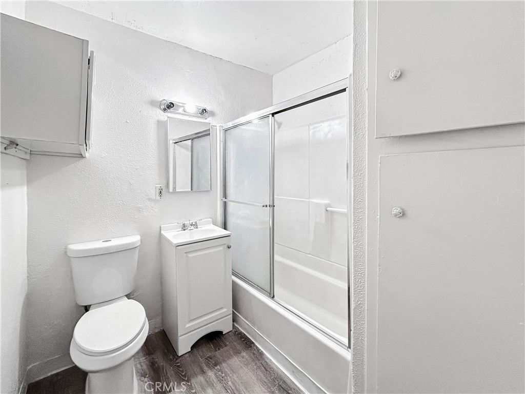 1109 South Minnie Street Santa Ana, CA 92701 - Photo 11 of 20 a bathroom with a toilet and shower