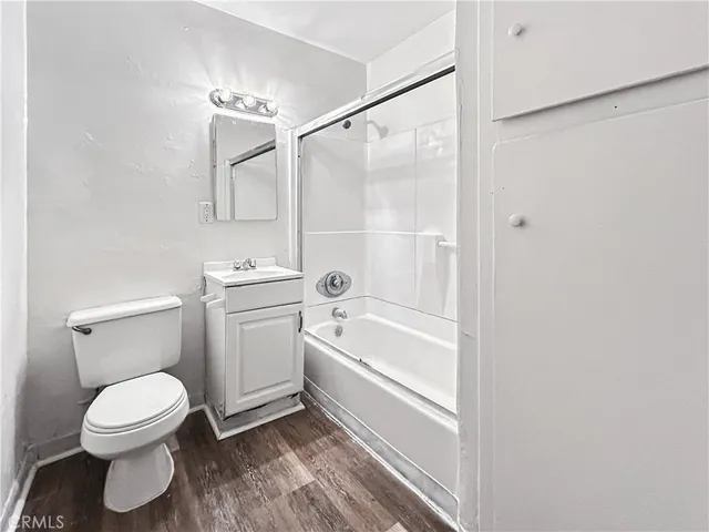 a bathroom with a toilet and a bathtub