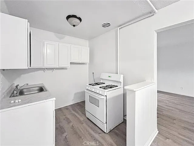 a kitchen with a stove and a microwave