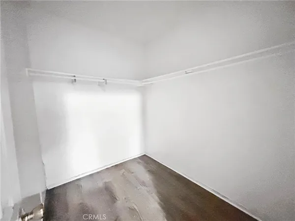 a view of a room with shelf on the wall