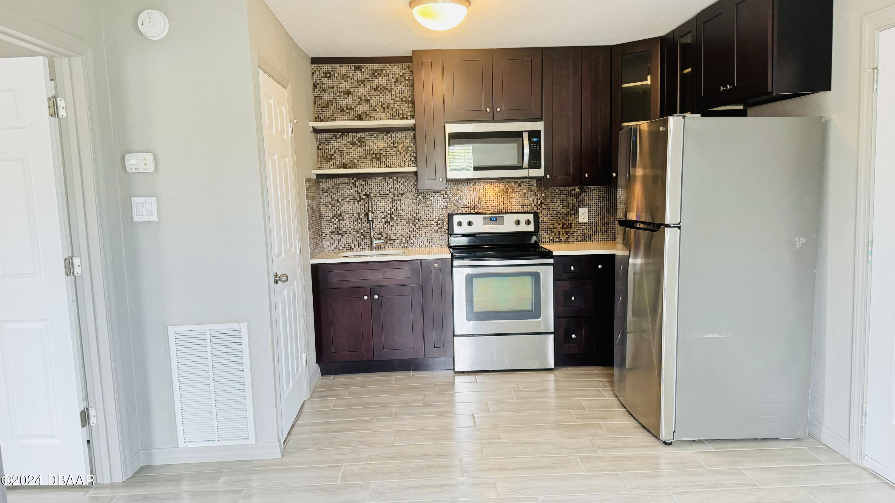 71 Rockefeller Drive, Unit A Ormond Beach, FL 32176 - Photo 10 of 21 IMG_1040
