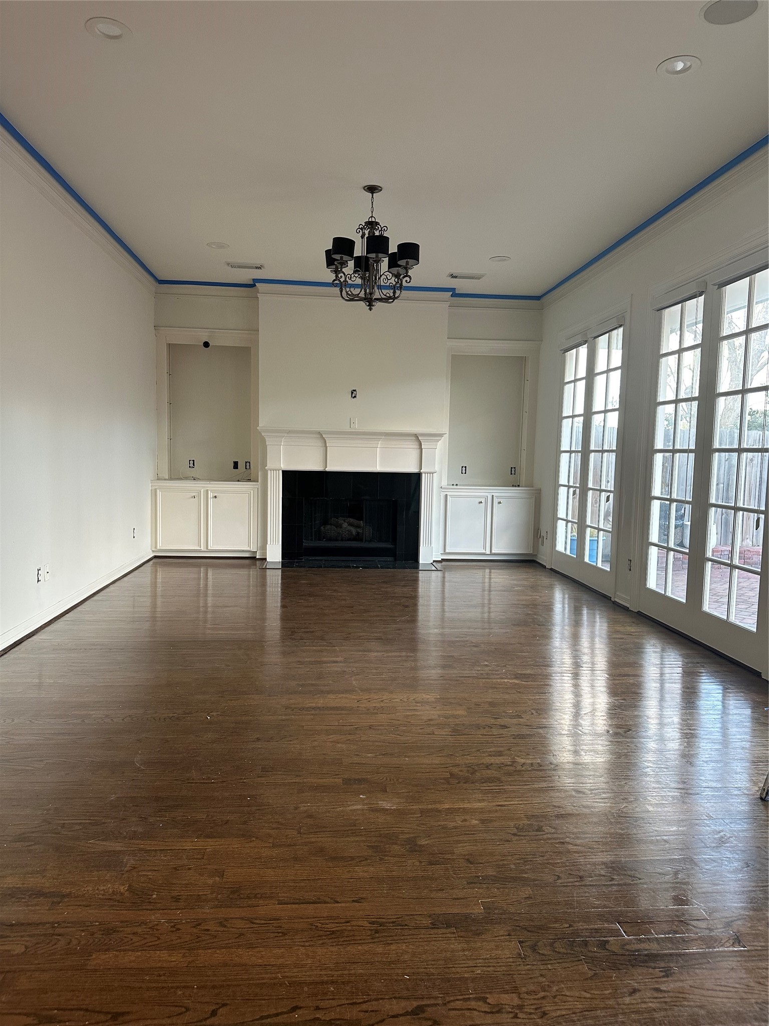 732 Highgrove Park Houston, TX 77024 - Photo 4 of 8 an empty room with windows and fireplace