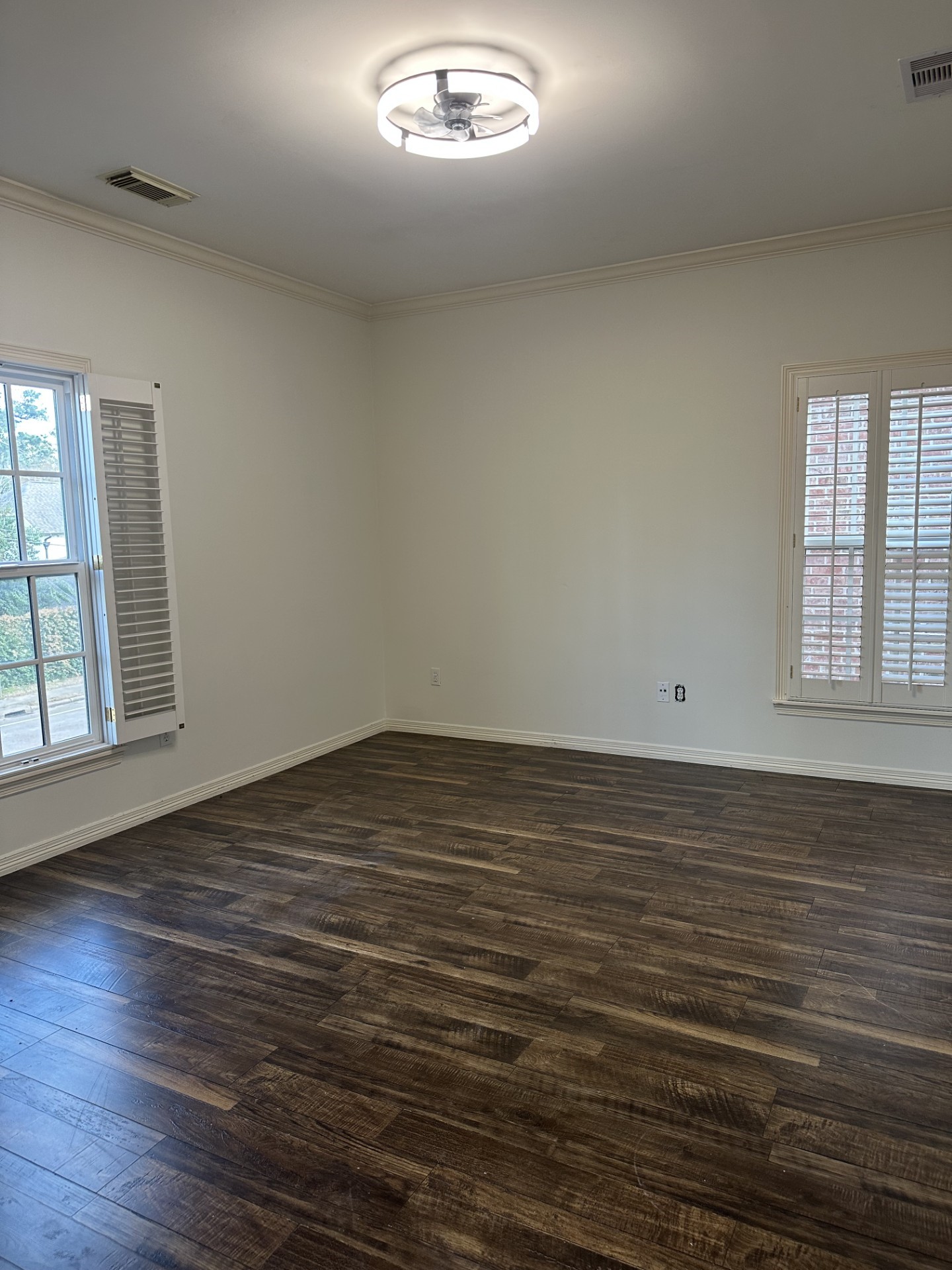 732 Highgrove Park Houston, TX 77024 - Photo 7 of 8 an empty room with wooden floor and windows