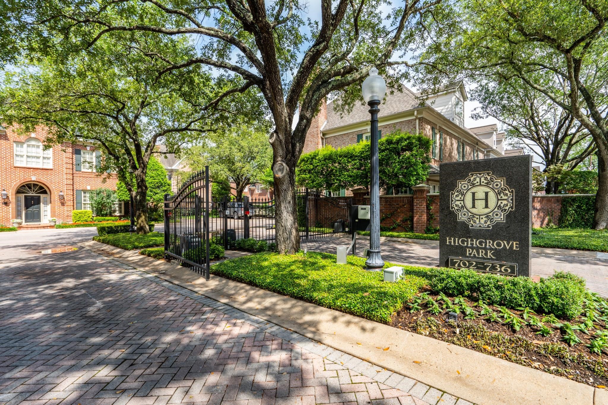 732 Highgrove Park Houston, TX 77024 - Photo 8 of 8 a front view of a house with a yard and potted plants
