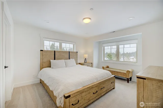 a bathroom with a granite countertop sink a toilet and shower