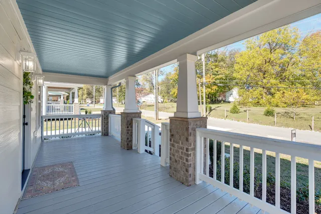 a view of a porch with wooden floor and outdoor space