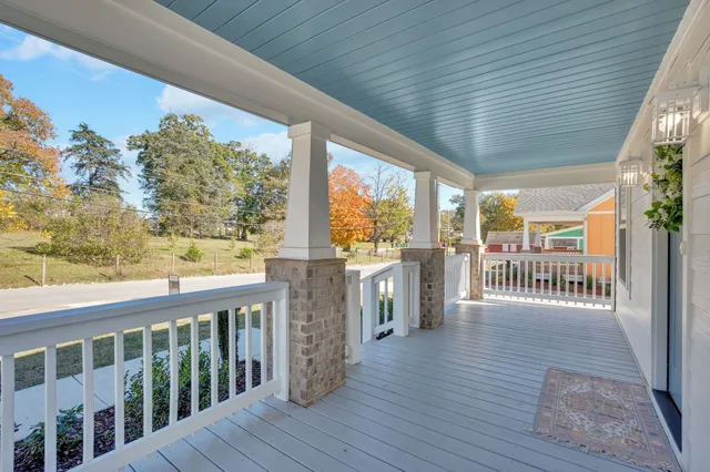 a view of a balcony with wooden floor