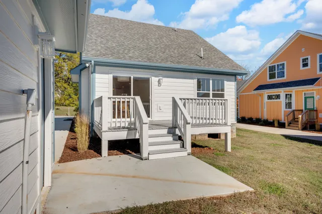 an aerial view of a house with outdoor space and lake view