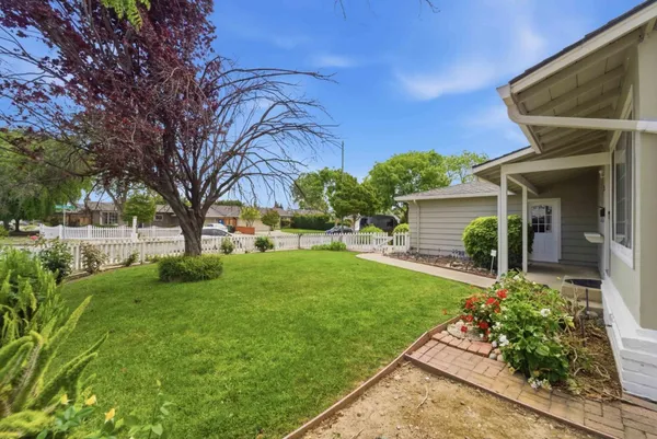a front view of a house with garden