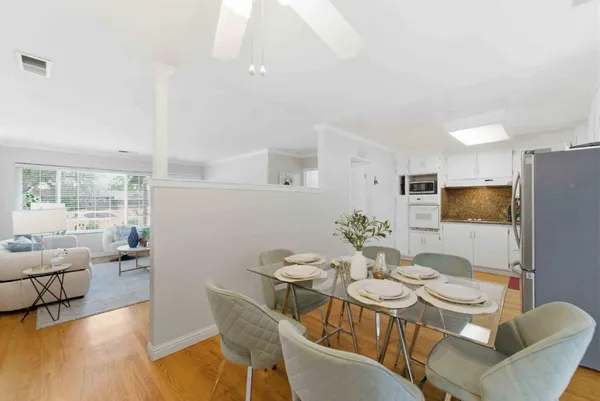 a view of a dining room with furniture window and outside view