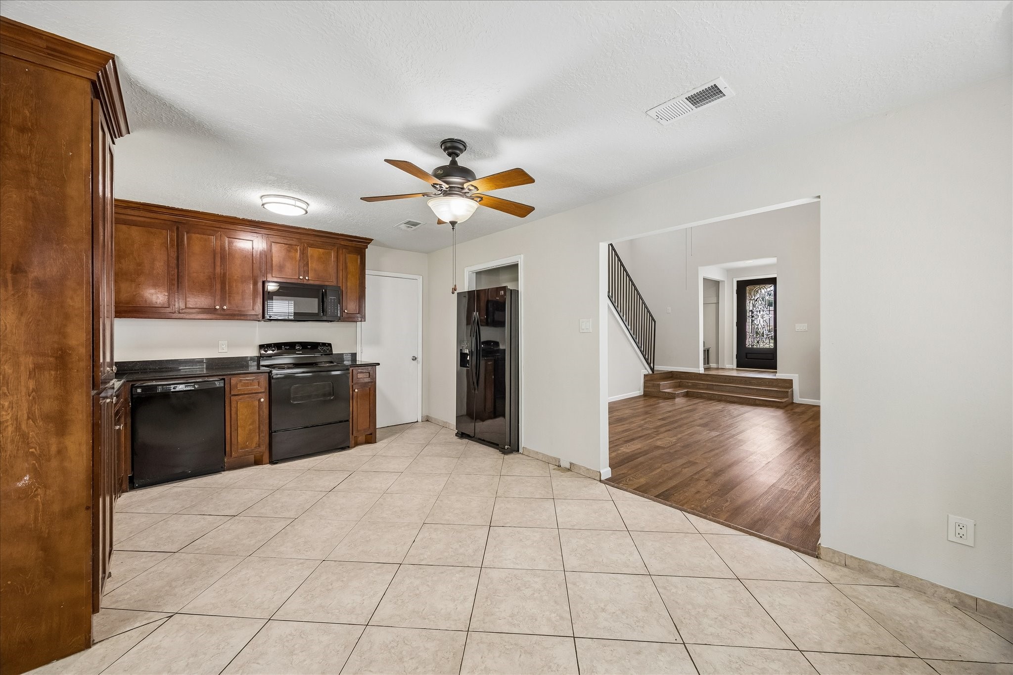 10411 Goodrum Road Houston, TX 77041 - Photo 9 of 25 Tiled floors throughout the kitchen and dining area