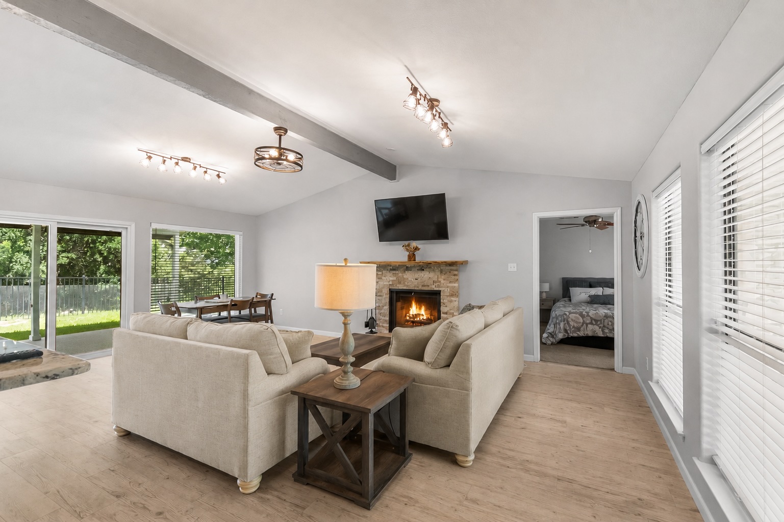 210 Teeoff, Unit B Horseshoe Bay, TX 78657 - Photo 8 of 38 A welcoming living room featuring a stone-clad fireplace