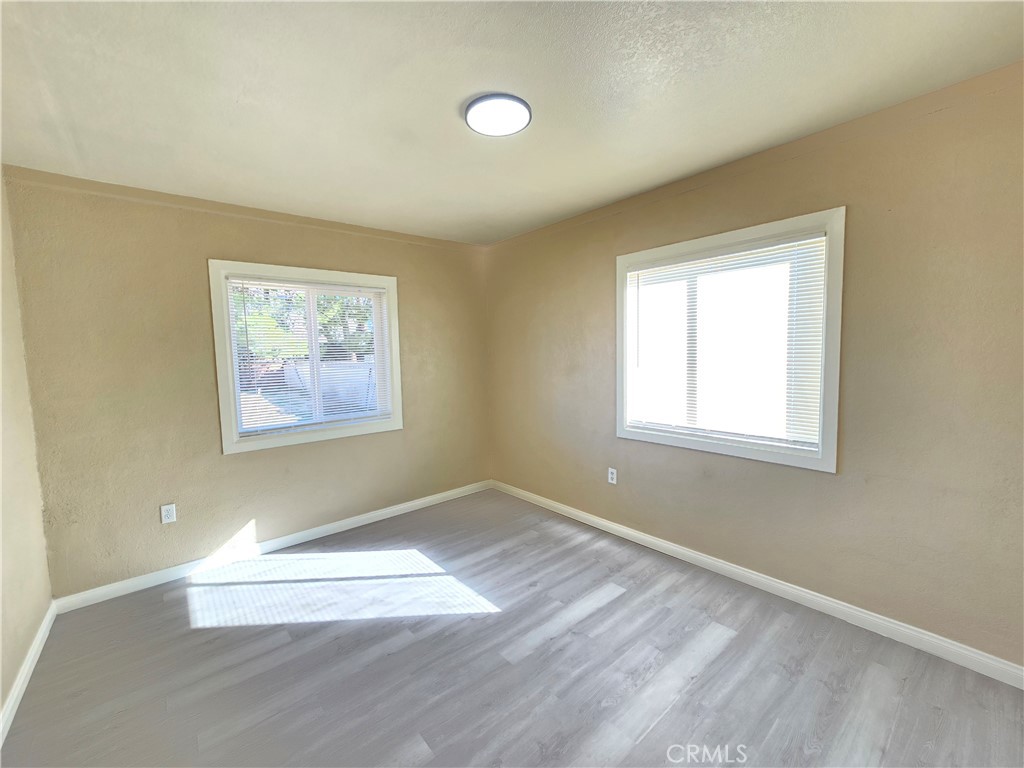 8651 S Loop California City, CA 93505 - Photo 13 of 16 an empty room with a window