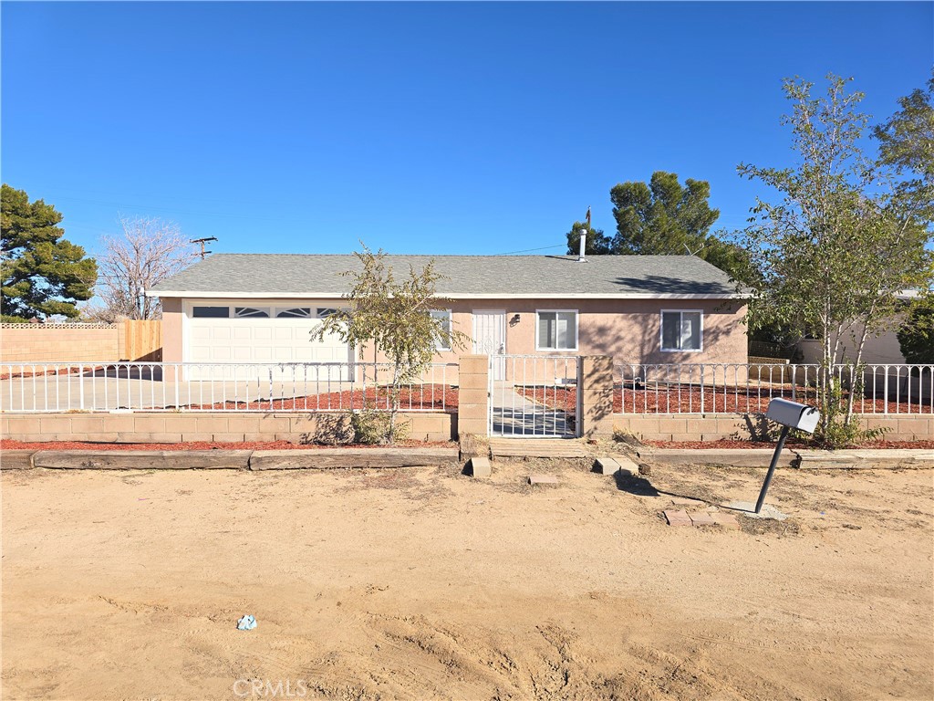 8651 S Loop California City, CA 93505 - Photo 2 of 16 a view of a house with a swimming pool