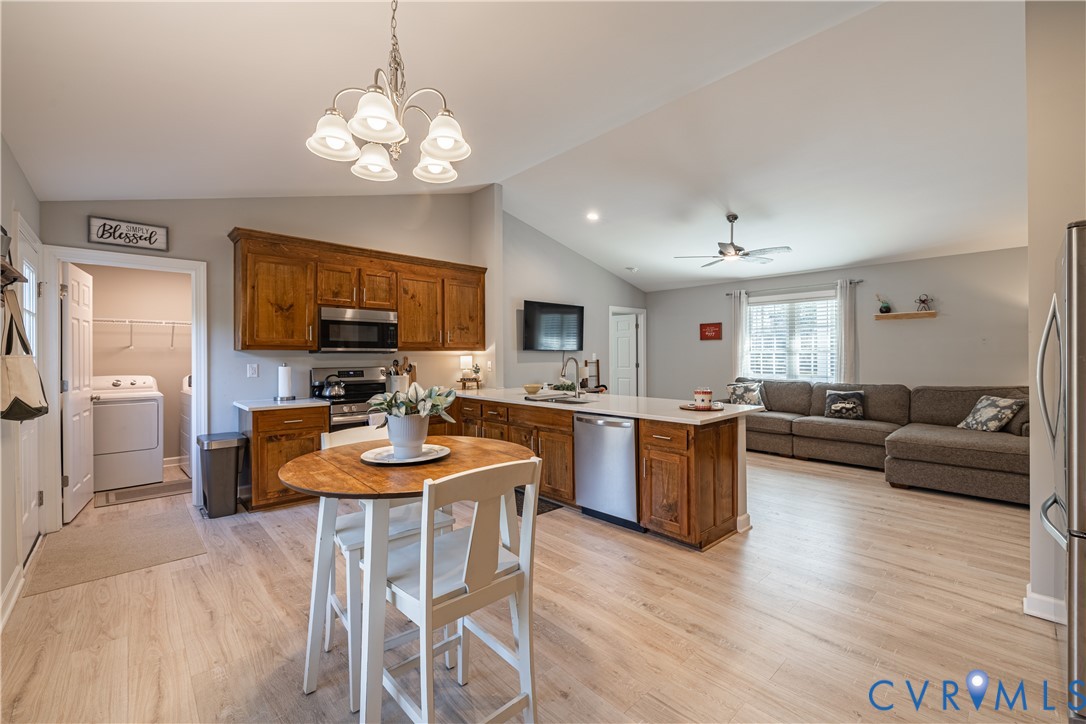 180 Barefords Mill Road Dunnsville, VA 22454 - Photo 14 of 27 a view of a dining room with furniture and wooden floor