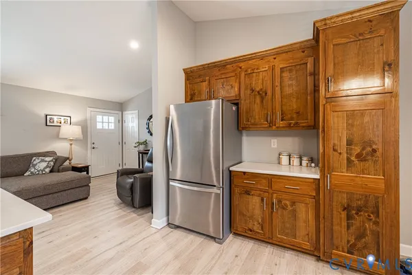 a kitchen with stainless steel appliances a refrigerator and cabinets