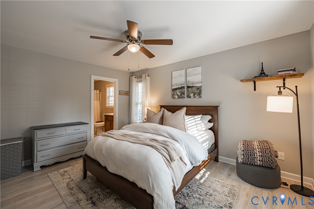 180 Barefords Mill Road Dunnsville, VA 22454 - Photo 16 of 27 a bedroom with bed and window