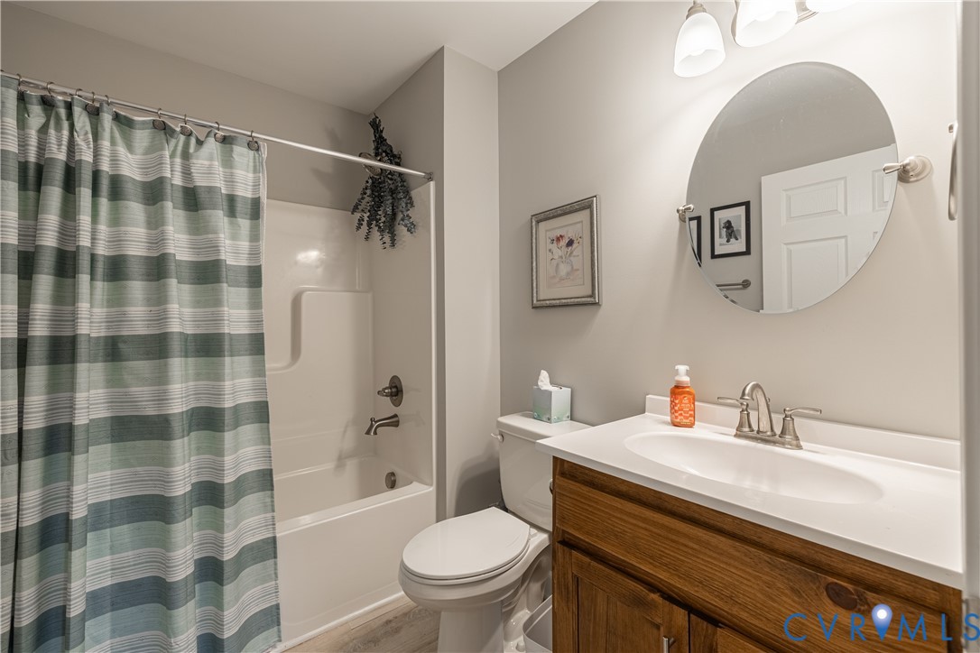 180 Barefords Mill Road Dunnsville, VA 22454 - Photo 20 of 27 a bathroom with a sink toilet and shower