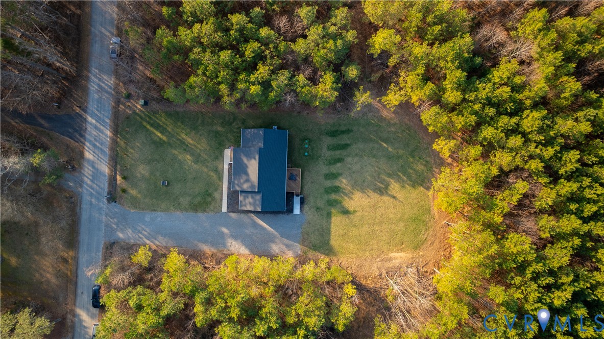 180 Barefords Mill Road Dunnsville, VA 22454 - Photo 3 of 27 a view of a yard with plants