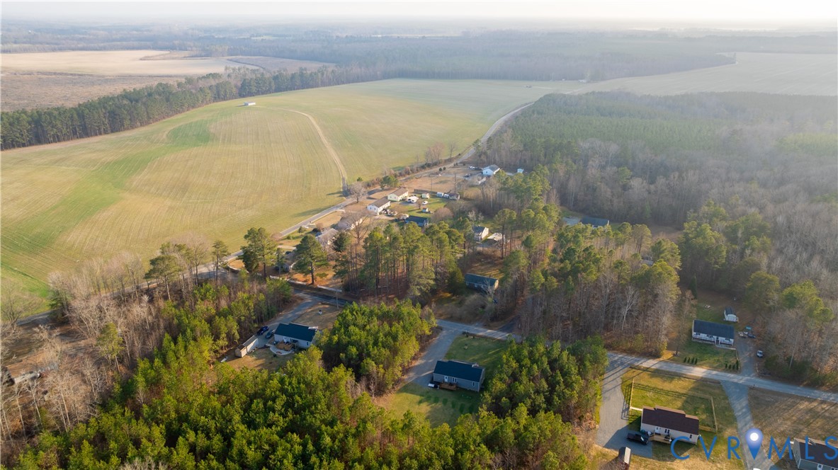 180 Barefords Mill Road Dunnsville, VA 22454 - Photo 4 of 27 a view of a lake with a yard and mountain view