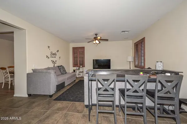a view of a livingroom with furniture and a flat screen tv