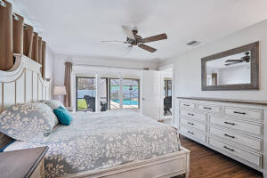 8766 Southeast Longview Drive Hobe Sound, FL 33455 - Photo 16 of 27 a living room with furniture and a dresser