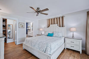 8766 Southeast Longview Drive Hobe Sound, FL 33455 - Photo 17 of 27 a bedroom with a bed and a dresser