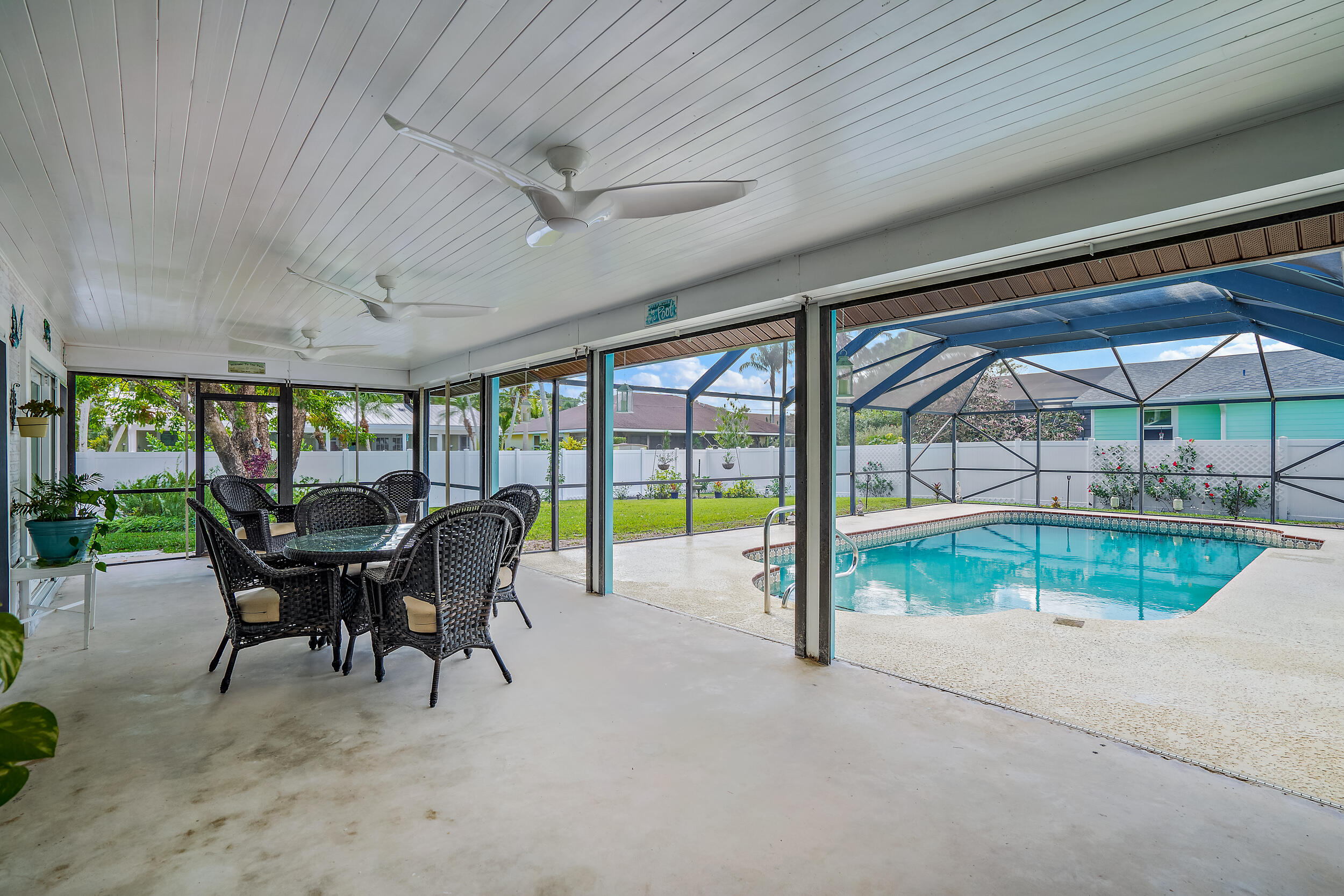 8766 Southeast Longview Drive Hobe Sound, FL 33455 - Photo 20 of 27 a view of a dining room with furniture window and backyard