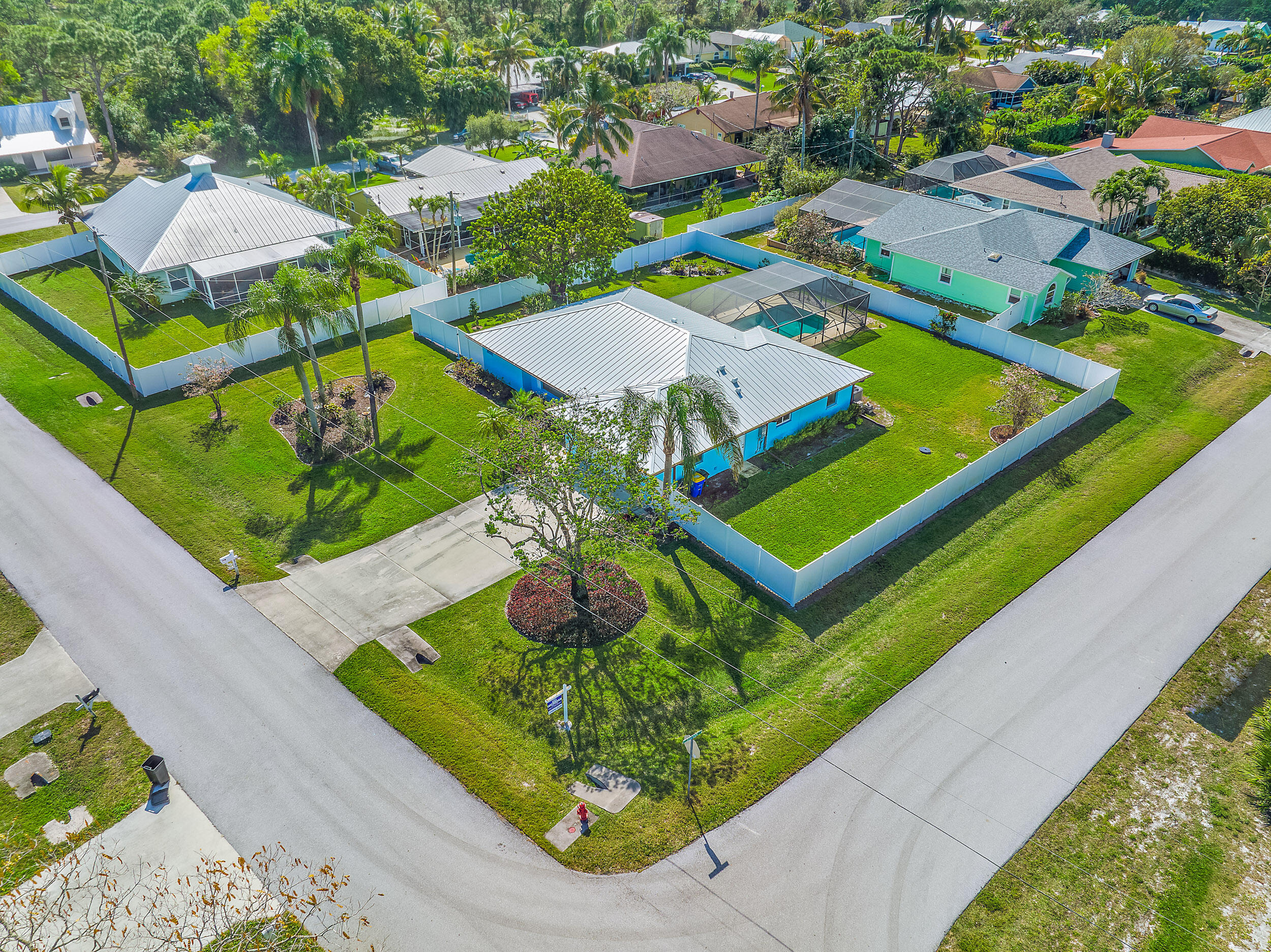 8766 Southeast Longview Drive Hobe Sound, FL 33455 - Photo 2 of 27 an aerial view of a house with swimming pool patio and outdoor seating
