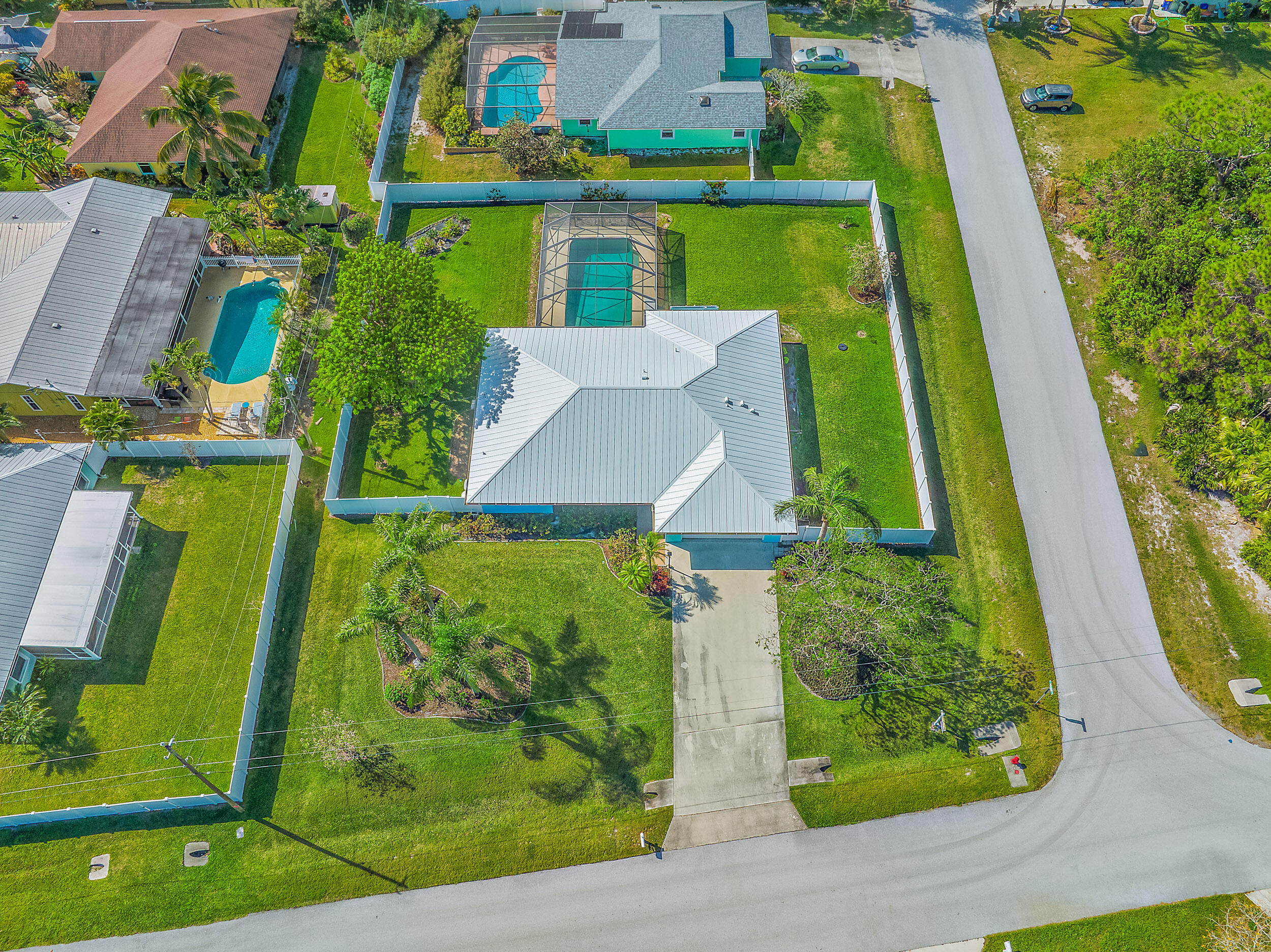 8766 Southeast Longview Drive Hobe Sound, FL 33455 - Photo 25 of 27 an aerial view of a residential houses with outdoor space