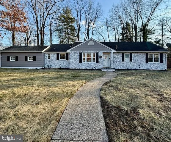 a front view of a house with yard