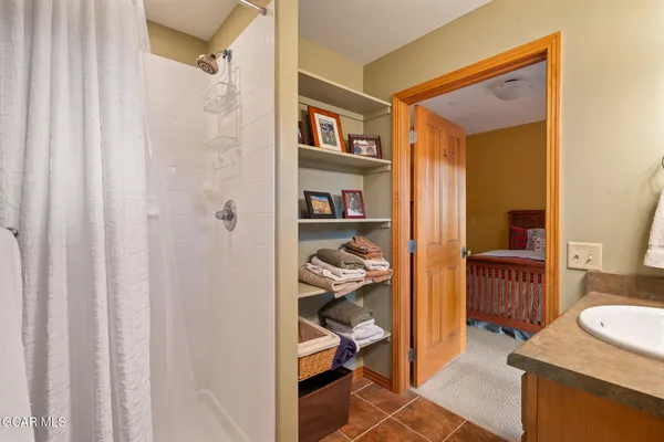 a room with wooden furniture and a window