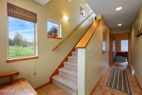 a view of a hallway with staircase