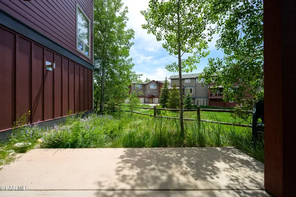 a view of backyard with green space