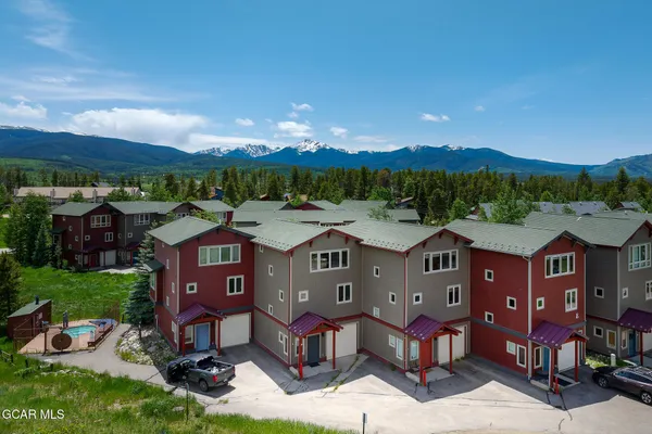 a aerial view of a house with a yard