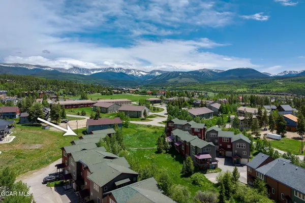 a view of a city with mountains in the background