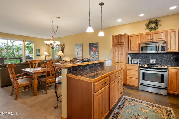 a kitchen that has a lot of cabinets in it