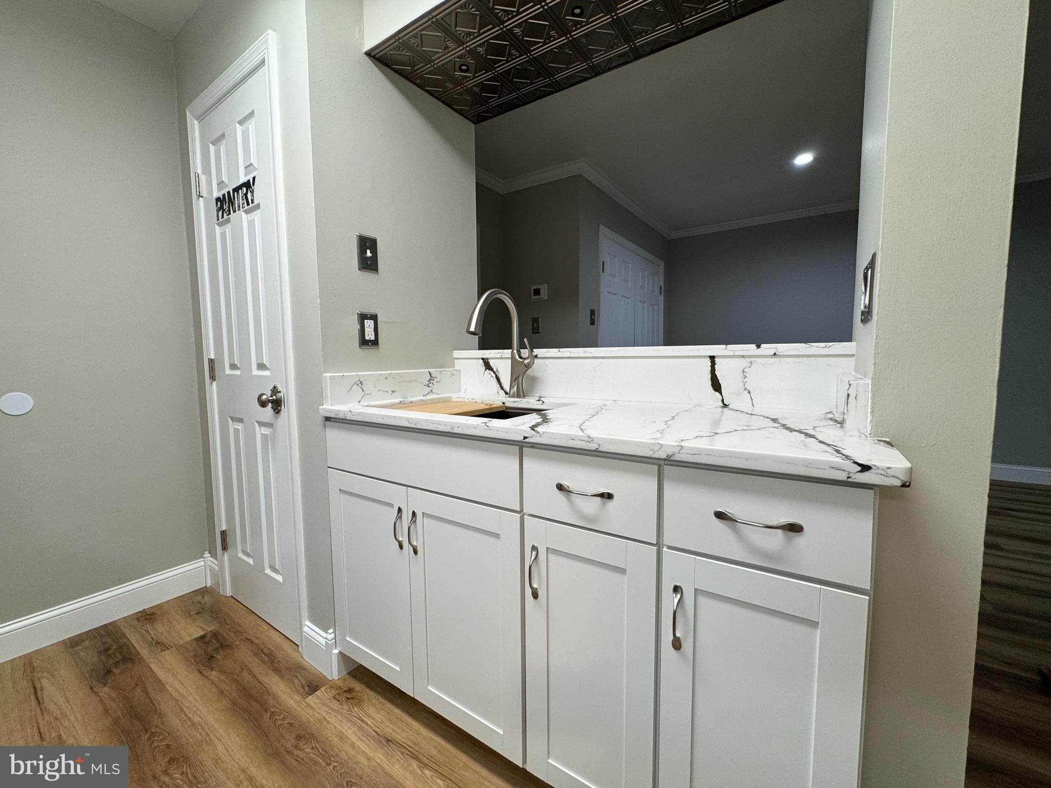 5812 Royal Ridge Drive, Unit C Springfield, VA 22152 - Photo 11 of 21 a bathroom with a sink and a mirror
