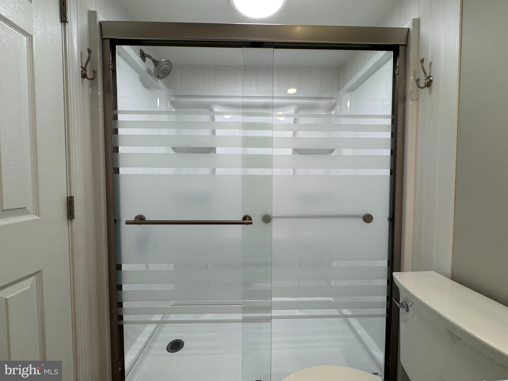 5812 Royal Ridge Drive, Unit C Springfield, VA 22152 - Photo 12 of 21 a bathroom with a glass shower door