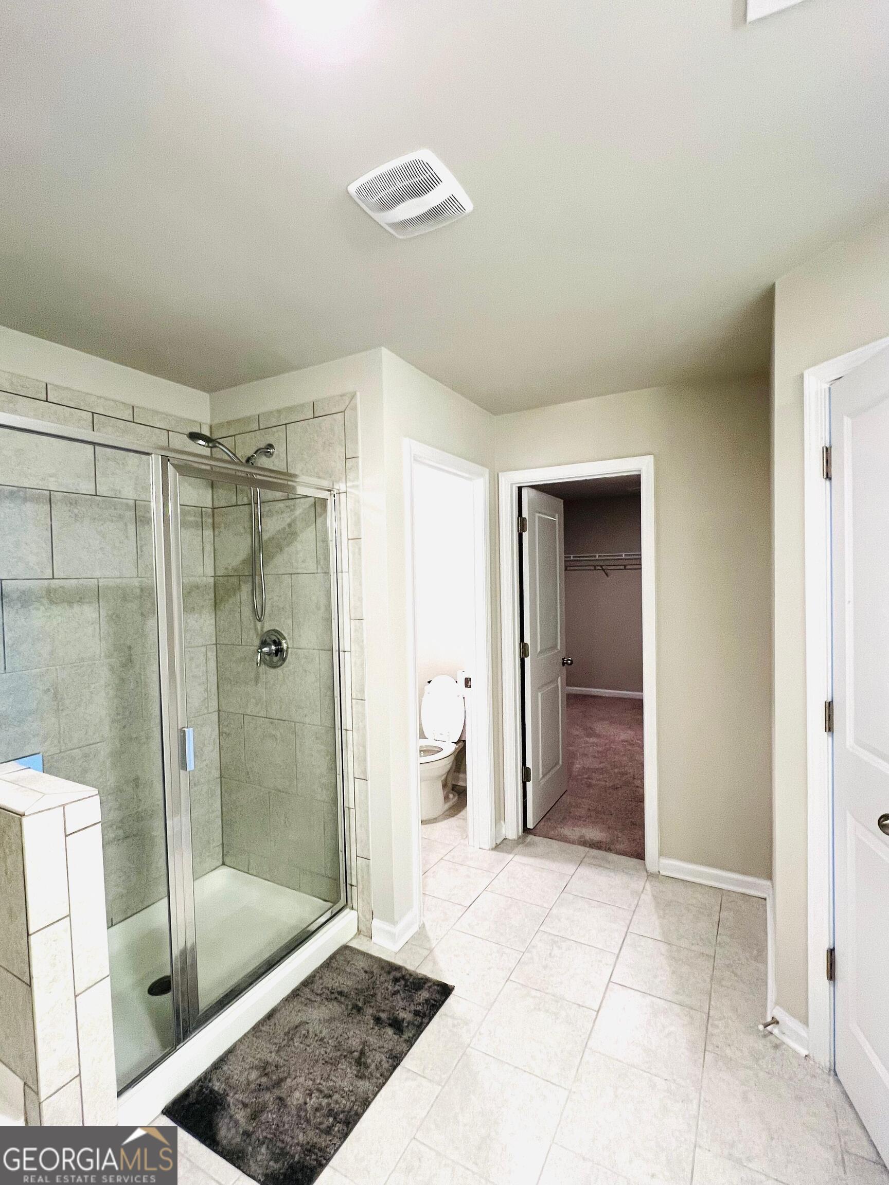 2206 Justify Lane Lithonia, GA 30058 - Photo 13 of 25 a bathroom with a shower and a sink