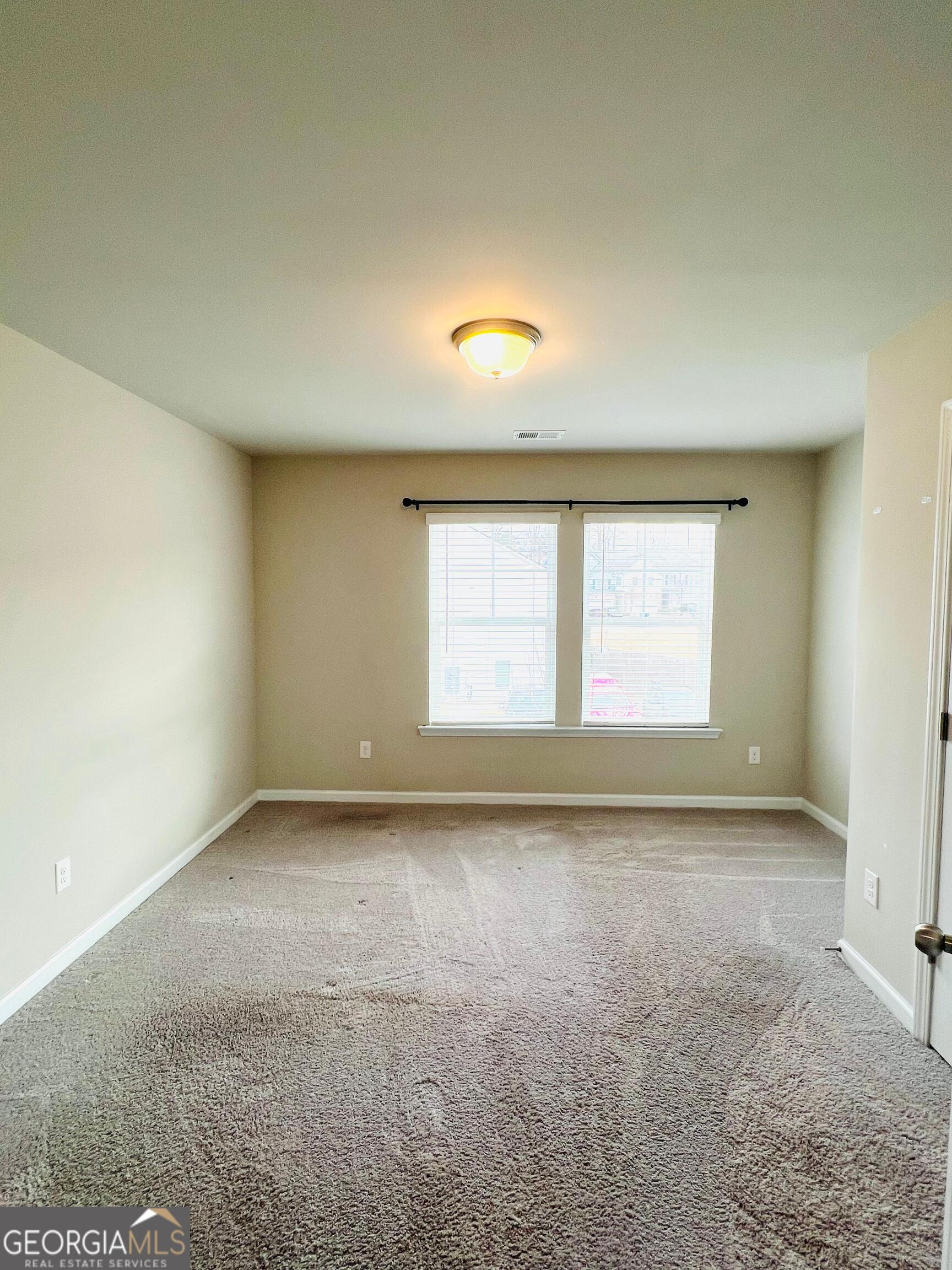 2206 Justify Lane Lithonia, GA 30058 - Photo 21 of 25 an empty room with a window