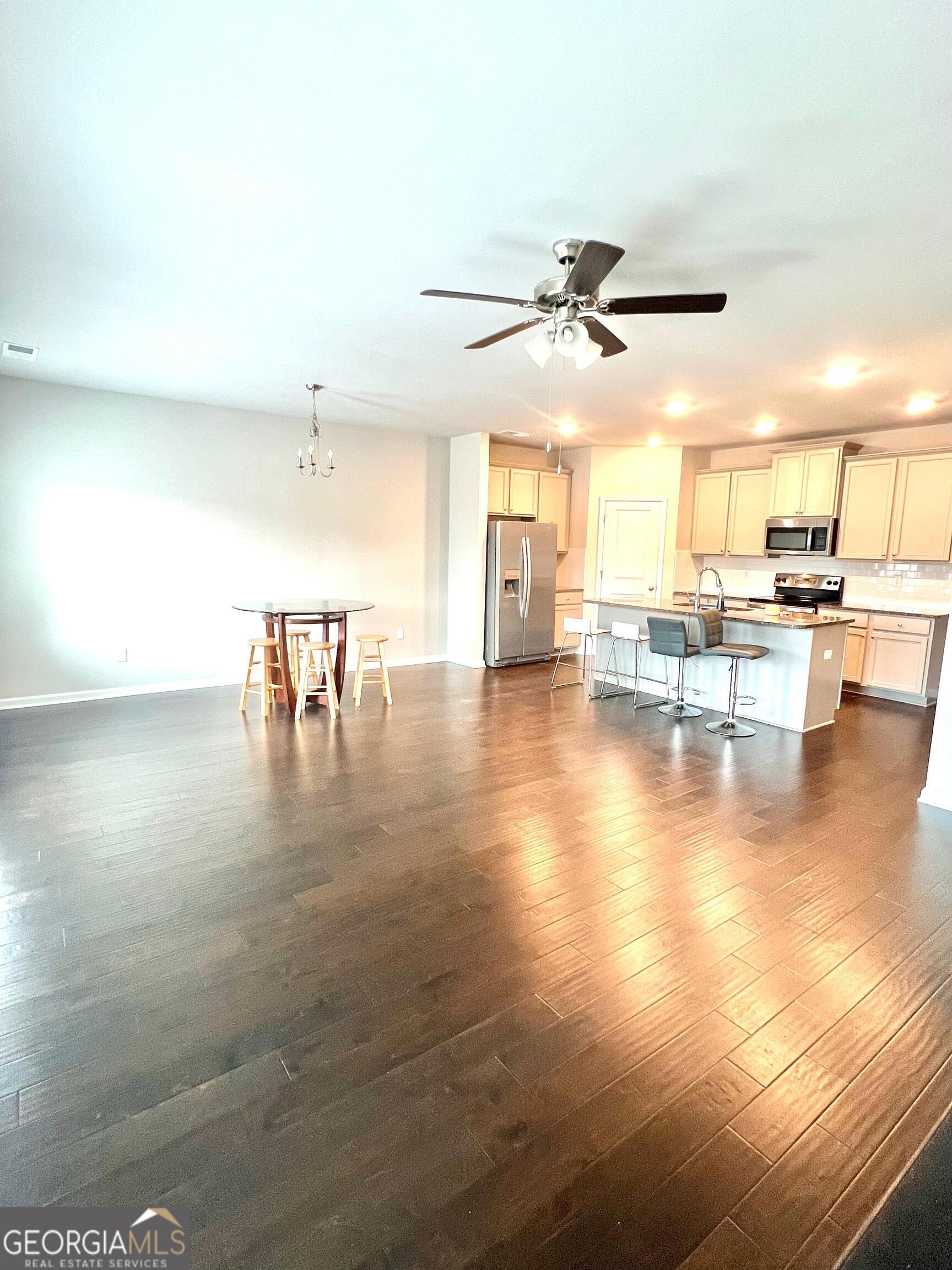 2206 Justify Lane Lithonia, GA 30058 - Photo 3 of 25 a view of a dining room with furniture
