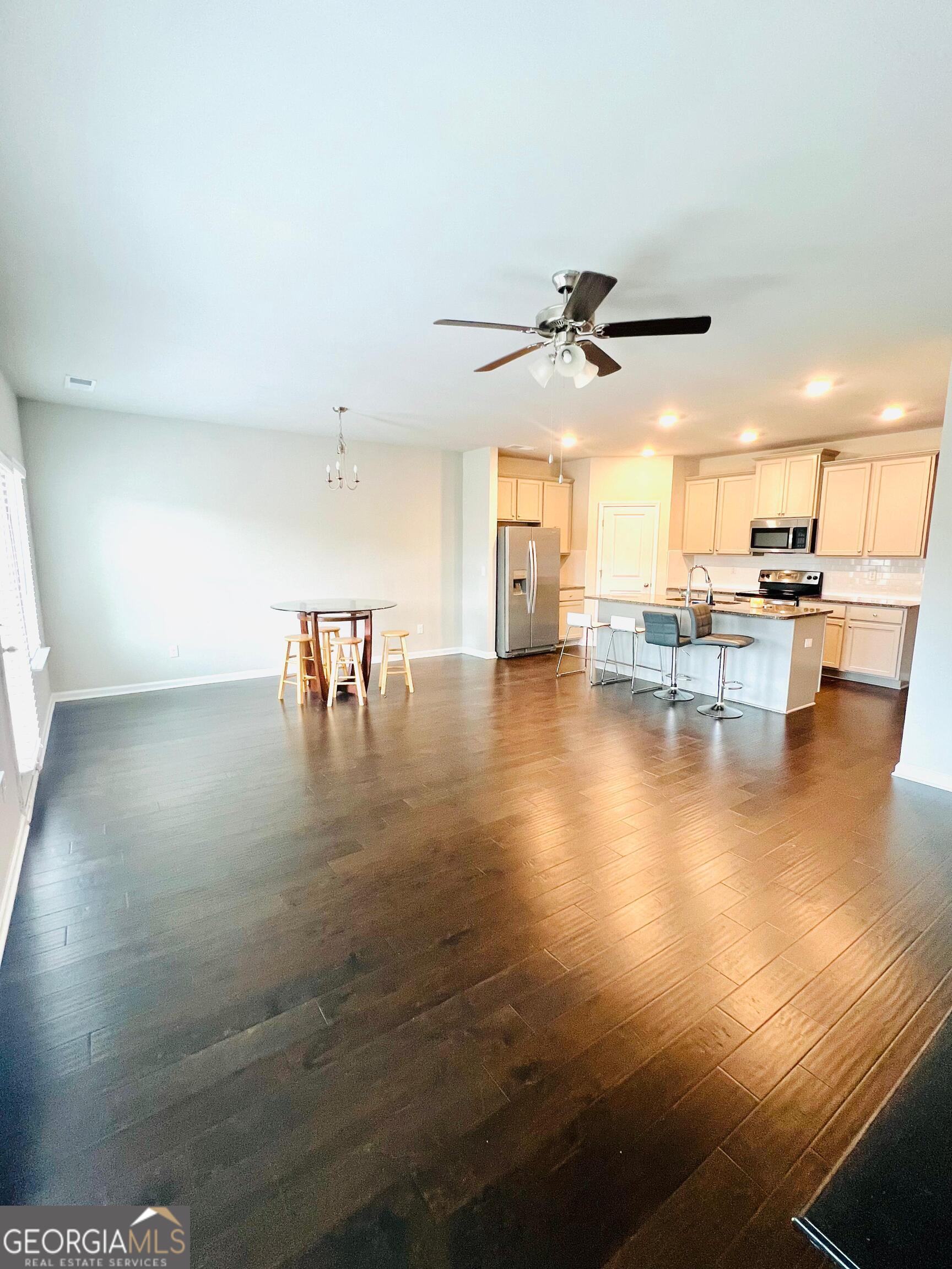 2206 Justify Lane Lithonia, GA 30058 - Photo 4 of 25 a view of a dining room with furniture