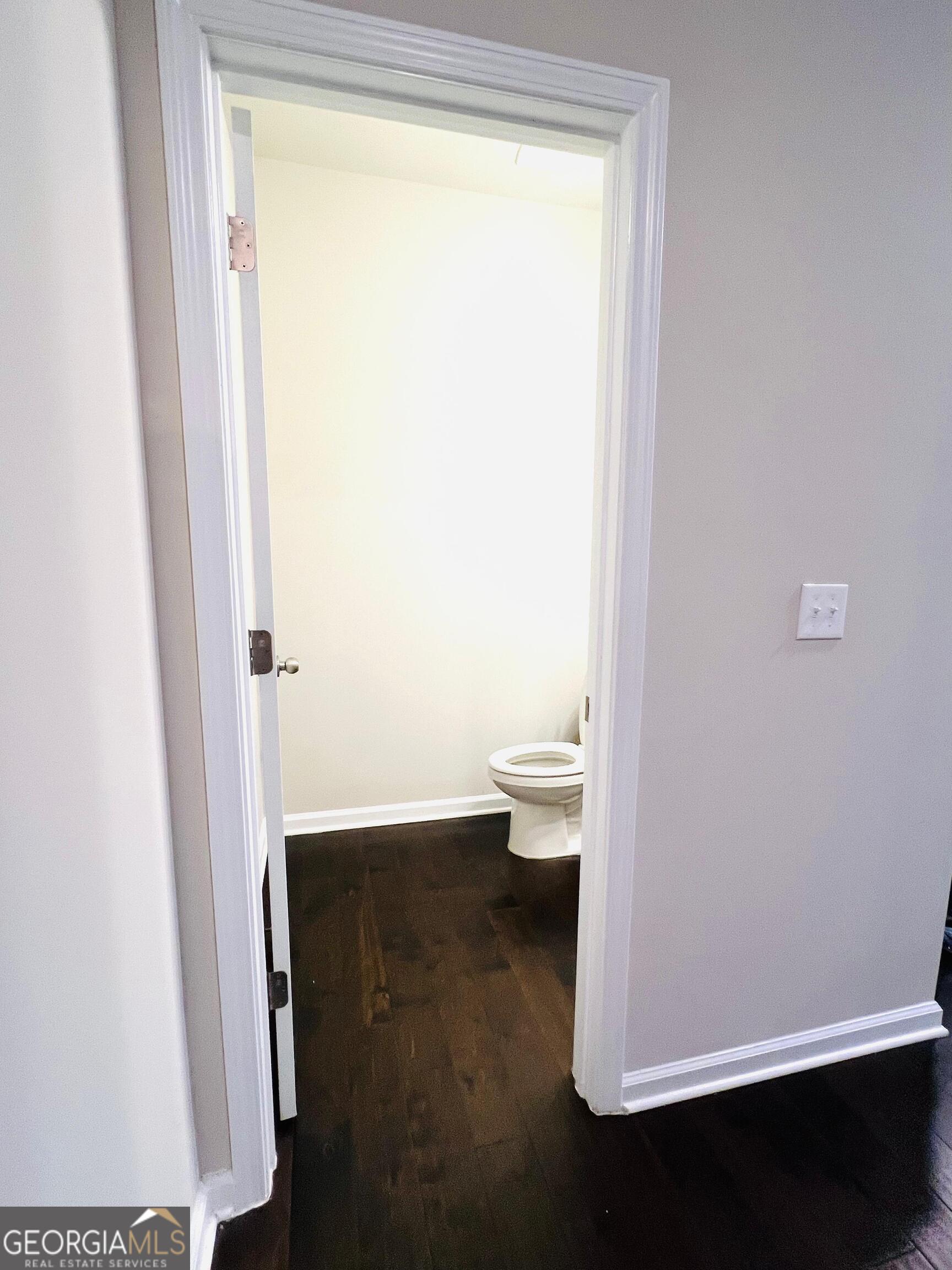 2206 Justify Lane Lithonia, GA 30058 - Photo 10 of 25 a bathroom with a toilet and a shower
