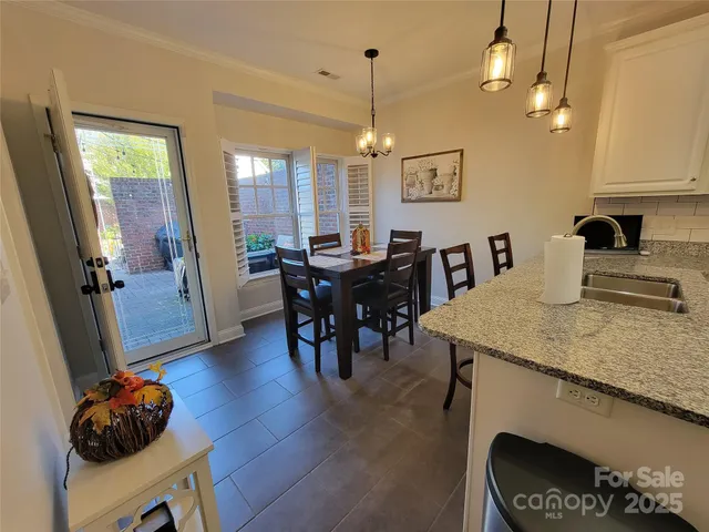 a view of a workspace with furniture and wooden floor