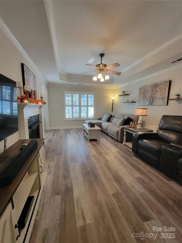 a bed room with a bed and a chandelier