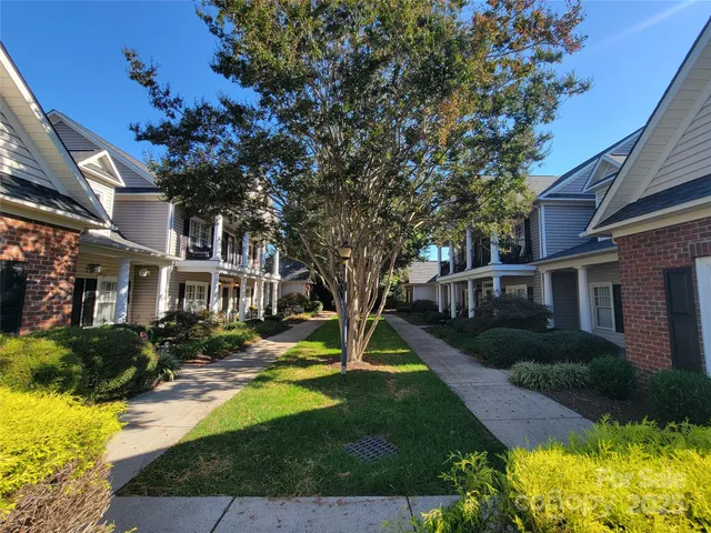a front view of house with outdoor seating