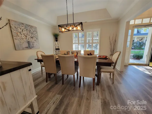 a kitchen with stainless steel appliances granite countertop a refrigerator a sink a stove and a refrigerator