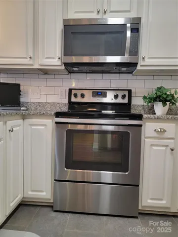a white refrigerator freezer sitting in a kitchen