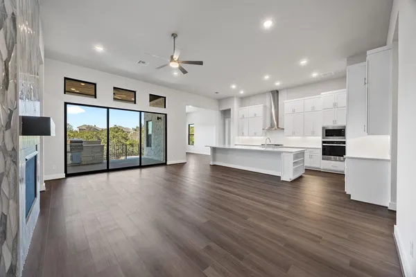 a view of kitchen with stainless steel appliances refrigerator oven and stove